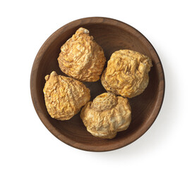 Dried yellow Maca in the wooden bowl, isolated on white background, top view