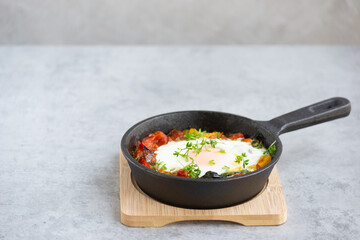 Baked egg on grey background