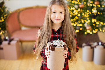 Little girl with Chritmas present.