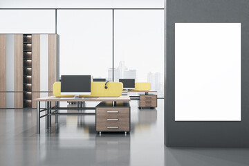 Modern bright coworking office interior with clean mock up poster on wall, yellow partition, panoramic windows with city view, wooden furniture and empty computer screens. 3D Rendering.