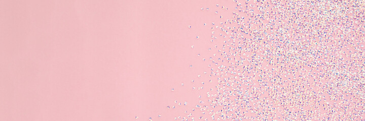 Pink color banner with shiny crystals. View from above, copy space.