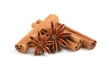 Obraz na płótnie Canvas Dry anise stars and cinnamon sticks on white background