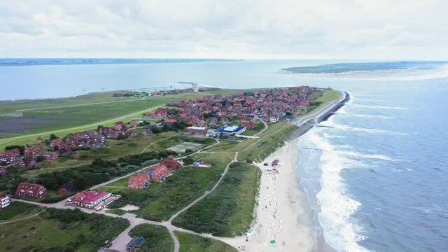 Panorama of Baltrum island in the North Sea, view of houses and sandy beach shore