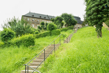Fototapeta na wymiar steps through a green landscape in the village