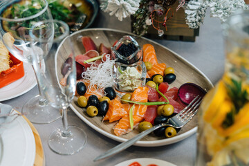 Fish plate, salmon, salmon, caviar. Mvslin laid out on a plate.