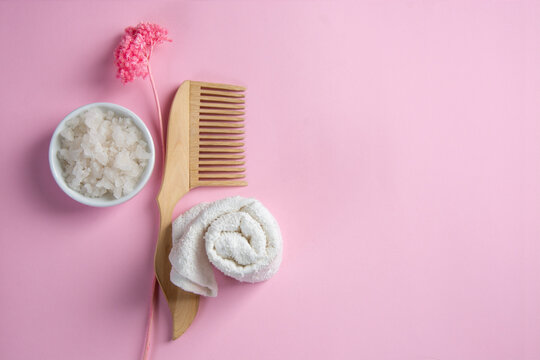 Healthcare Concept, Epsom Bath Salts, Wooden Hairbrush, Towel And Pink Flower On Pink Background. Eco, Zero Waste, Reusable, Plastic Free Environment