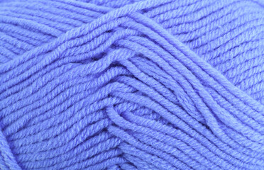Blue knitting wool close-up.Blue yarn clew close up texture. Blue wool background.