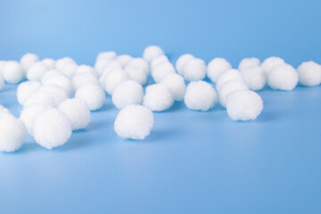 White Pom-Pom on Blue Background