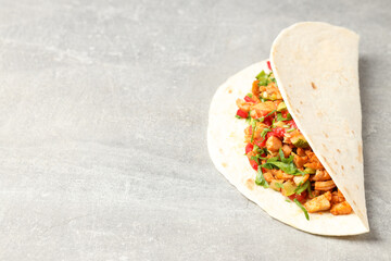 Fototapeta na wymiar Tasty taco on grey textured background, close up