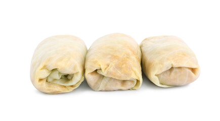 Uncooked stuffed cabbage rolls on white background