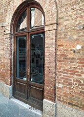 Fototapeta na wymiar Italy, Tuscany: Ancient glass door.