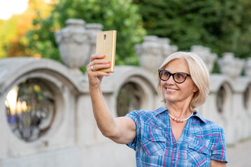 Beautiful senior woman taking a selfie