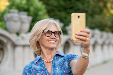 Beautiful senior woman taking a selfie