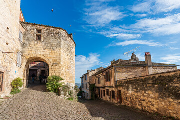 Obraz premium Old street and porch of the medieval village of Cordes sur Ciel, in the Tarn, in Occitanie, France