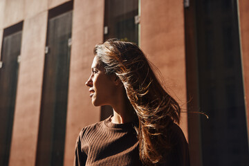 Young beautiful businesswoman standing and smiling