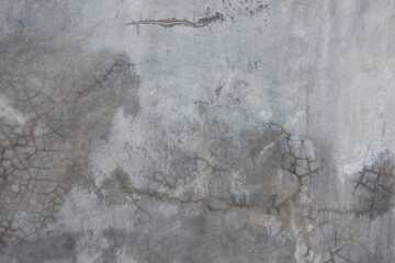 Horizontal dark old cement wall for the background, Texture of a grungy black concrete wall as background.