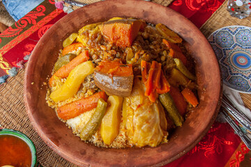 Tajine with vegetables. A tajine or tagine is a North African dish, named after the earthenware pot...
