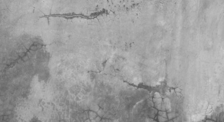 Horizontal dark old cement wall for the background, Texture of a grungy black concrete wall as background.