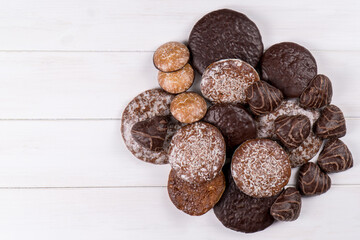 Typical German gingerbread cookies on a white background.Traditional Christmas treat.  Bakery products, top view, copy space