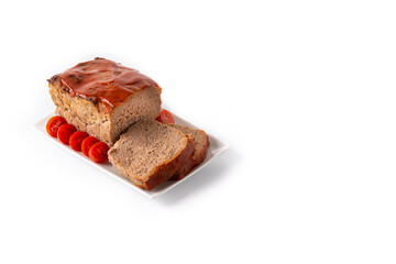 Traditional American meatloaf with ketchup isolated on white background. Copy space