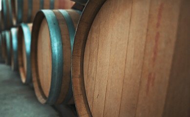 Wine barrels stacked in the cellar.