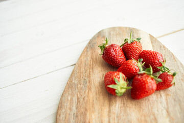 fresh strawberries on wooden board fruit vitamins summer