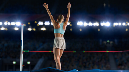 High Jump: Professional Female Athlete Happily Celebrating New Record with Raised Arms on World Sports Championship. Shot of Competition on Big Stadium with Sports Achievement Experience