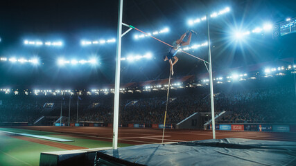 Pole Vault Jumping: Professional Male Athlete on World Championship Successfully Jumping with Pole...