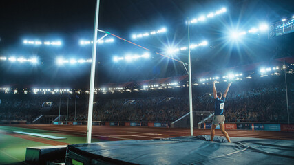 Pole Vault Jumping: Professional Male Athlete Happily Celebrating New Record with Raised Arms on...