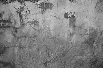 Horizontal dark old cement wall for the background, Texture of a grungy black concrete wall as background.