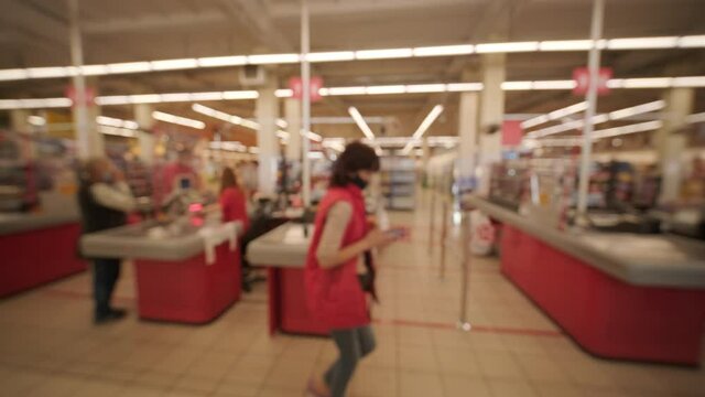 Blurred background. Checkout counters in the supermarket