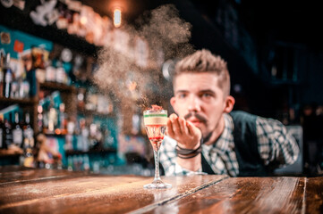 Barman concocts a cocktail on the taproom