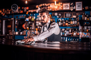 Bartender concocts a cocktail in the taproom