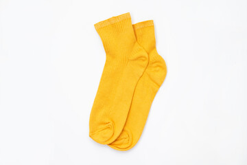 Yellow socks on an isolated white background