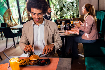 African American businessman having lunch in restaurant.