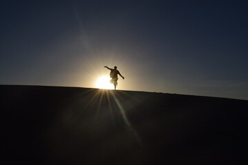 silhouette sunset over dune