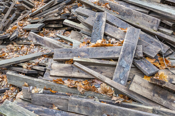 Heap of long wooden boards for the construction and improvement of the yard