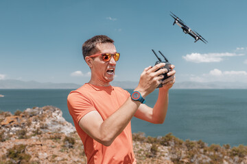Angry man drone operator screams and gets mad because of mistake and fall of the quadcopter. Laws...