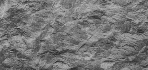 Abstract texture of the stone wall. Close-up. Light gray rock backdrop.