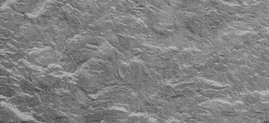 Abstract texture of the stone wall. Close-up. Light gray rock backdrop.