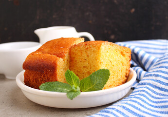 Semolina cake with pumpkin cut into pieces and garnished with mint