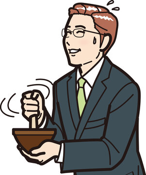 ゴマをする男性