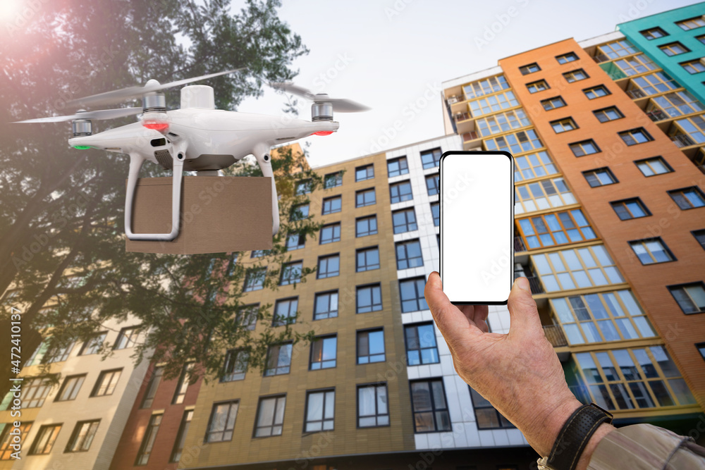 Poster senior man hand with phone on background of delivery drone. blank screen, you can add your content h