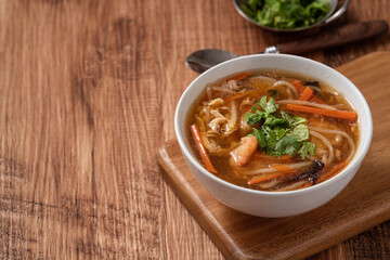Delicious traditional thick soup with shrimp meat ball and vegetables.