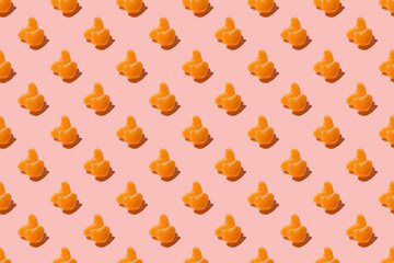Ripe fruit tangerines. Trendy sunlight summer pattern made with mandarine slice on bright light pink background. Minimal summer concept. Seamless pattern