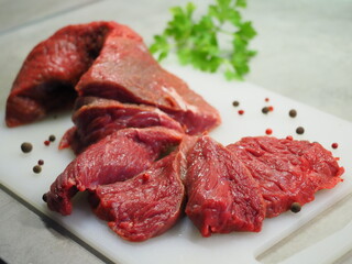 Boneless lamb steak meat with spices isolated on white Chopped beef, slices, abolition of vegetarianism, semi-finished meat products, soy meat