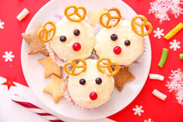 Cupcakes in the form of a deer on a red background