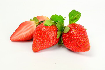 Three fresh strawberries isolated on white background