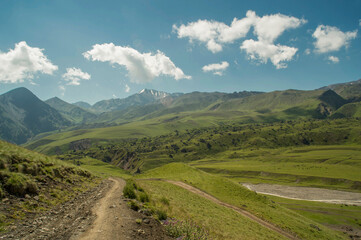 Fototapeta na wymiar A road in the mountains. Elbrus - the highest mountain in Europe