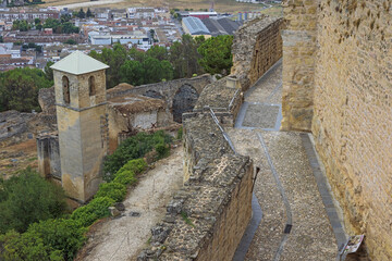 Fototapeta na wymiar The thick outer walls of the La Mota fortress, a large walled enclosure above Alcala la Real